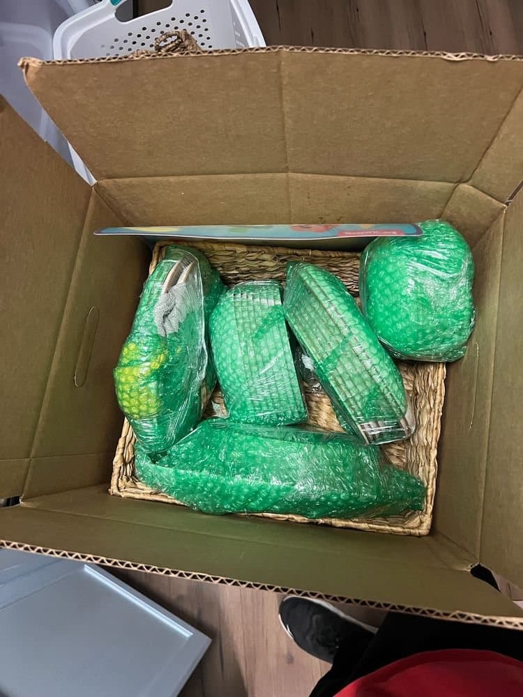 Fragile items wrapped in padding and packed into a moving box